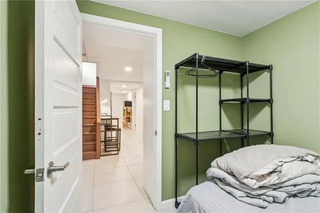 a bedroom with a bed and a table in it