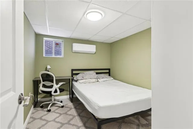 a bedroom with a bed and cabinets