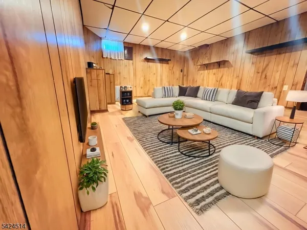 a dining room with furniture and a rug