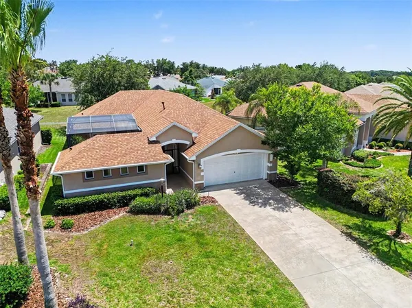 a aerial view of a house with a yard