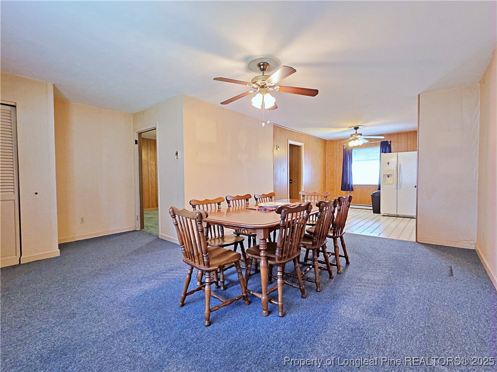 764 Old Vander Road Fayetteville, NC 28312 - Photo 6 of 50 a view of a dining room with furniture and a chandelier