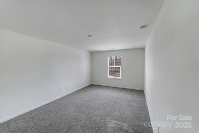 a view of a room that has a window in it