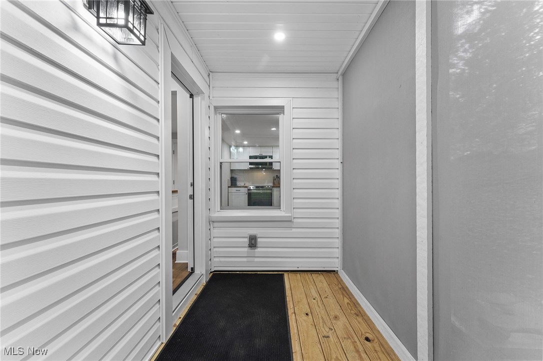 1062 Stump Road Akron, OH 44319 - Photo 18 of 42 Additional view of the enclosed deck featuring white vinyl siding
