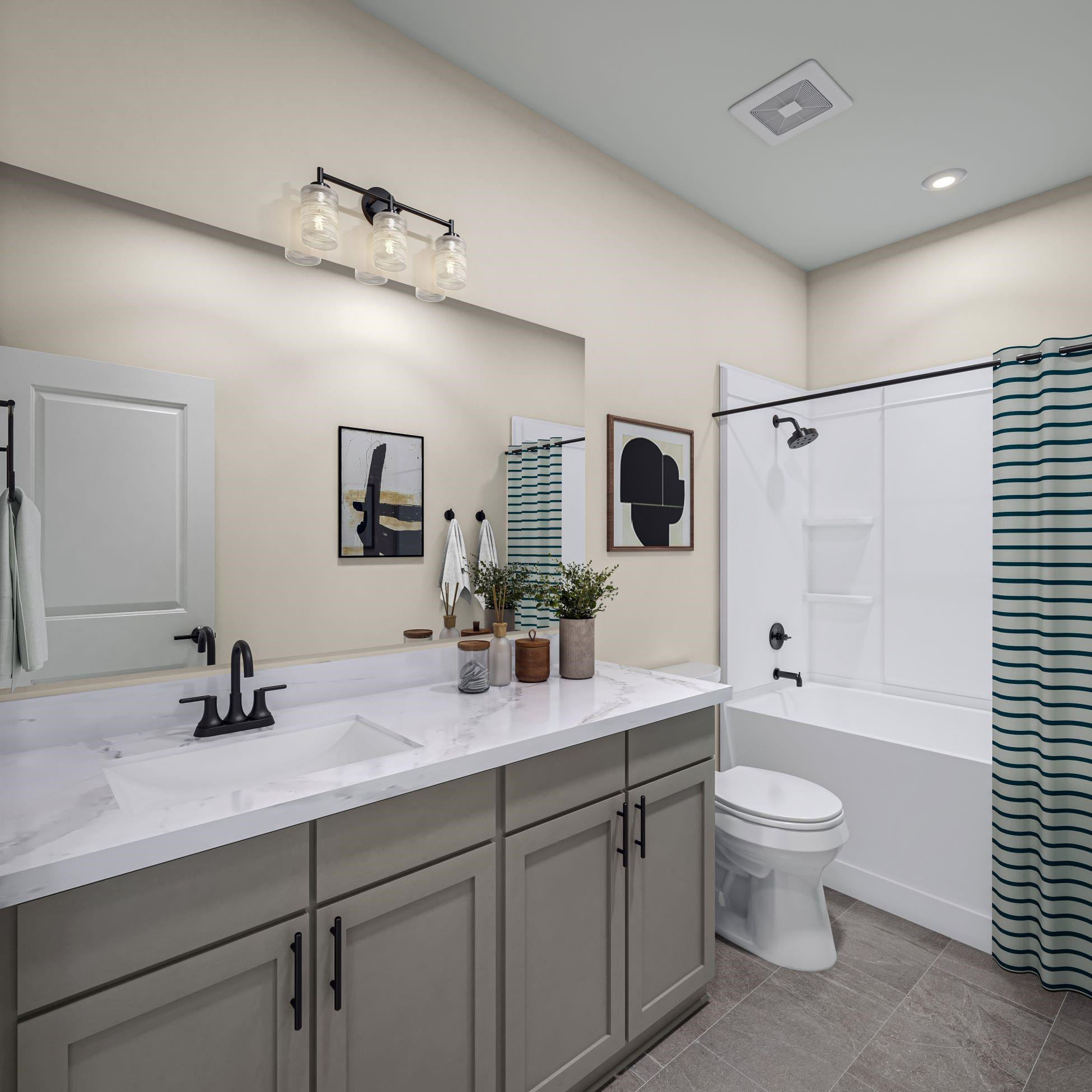 6104 Adecor Way Raleigh, NC 27617 - Photo 14 of 37 a bathroom with a double vanity sink toilet mirror and shower