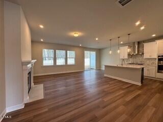 6104 Adecor Way Raleigh, NC 27617 - Photo 18 of 37 a view of kitchen with stove and cabinets