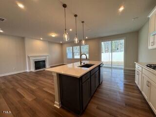 6104 Adecor Way Raleigh, NC 27617 - Photo 20 of 37 a kitchen with a stove and a wooden floor