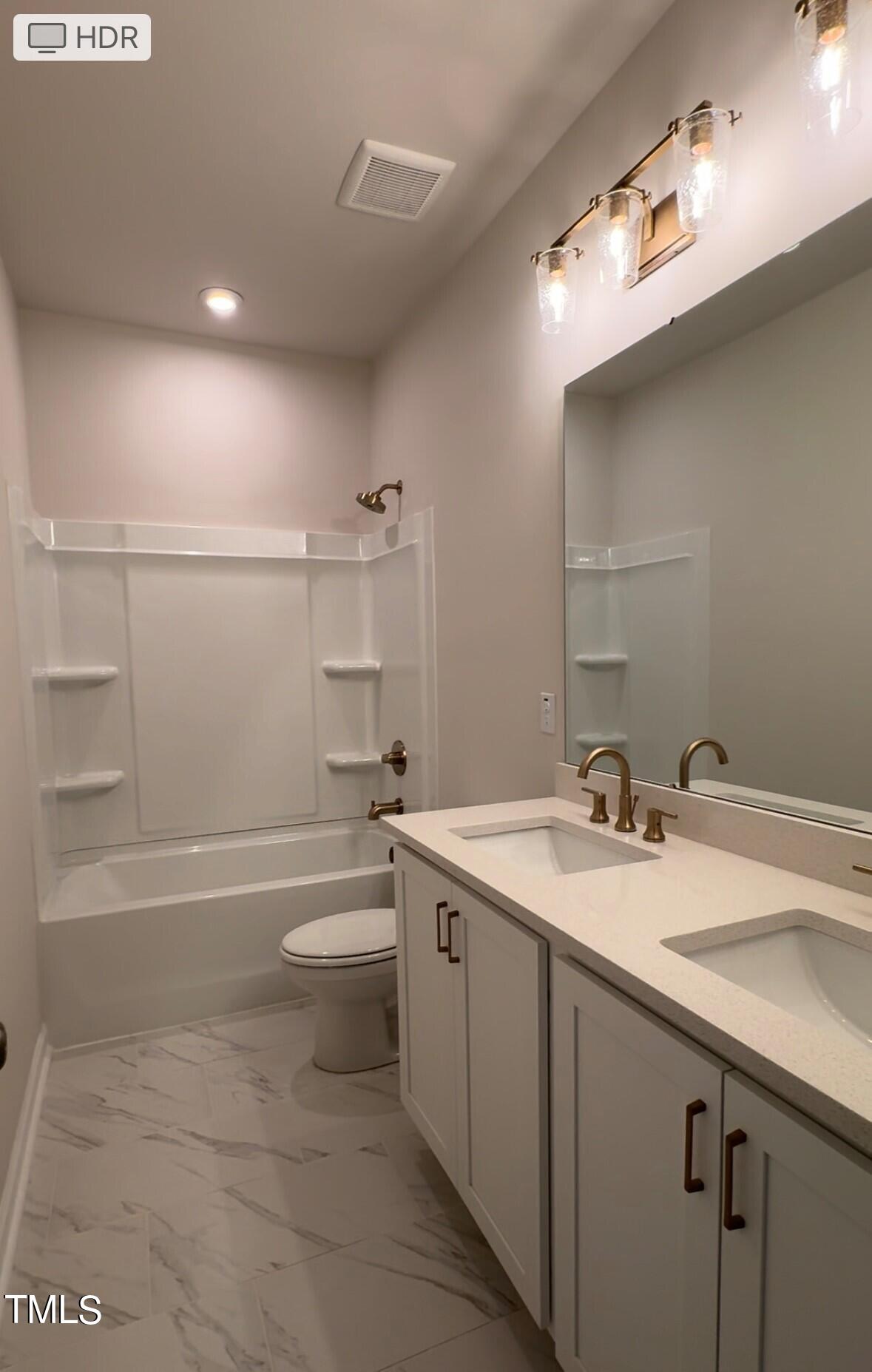 6104 Adecor Way Raleigh, NC 27617 - Photo 29 of 37 a bathroom with a sink a toilet and shower
