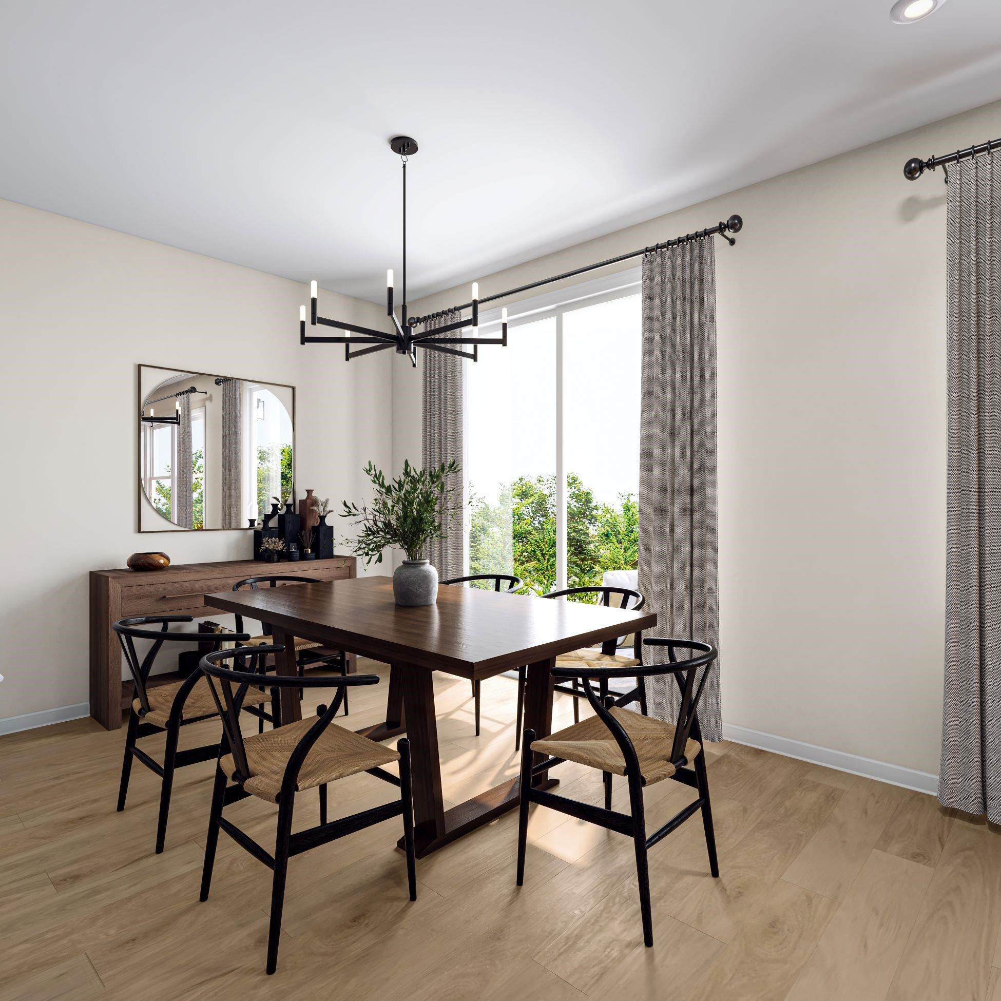 6104 Adecor Way Raleigh, NC 27617 - Photo 10 of 37 a view of a dining room and livingroom with furniture wooden floor a chandelier