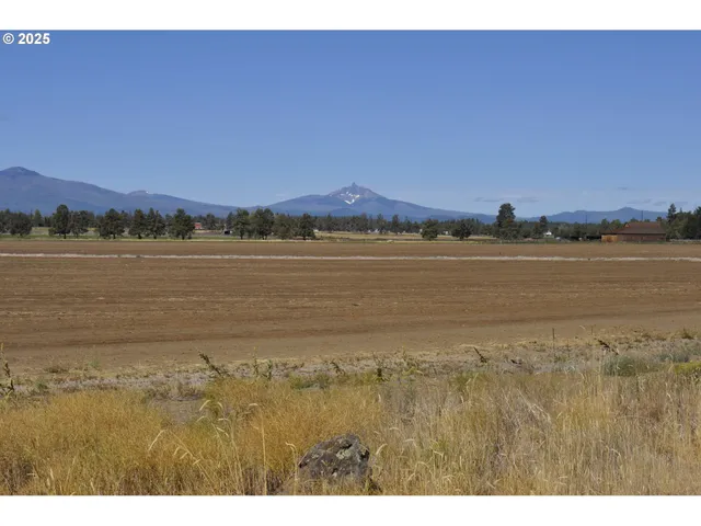 a view of an ocean and a mountain