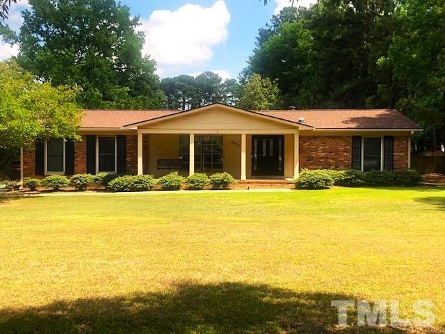 2822 Ellis Road Durham, NC 27703 - Photo 1 of 37 a front view of house with swimming pool and green space
