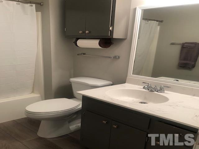 2822 Ellis Road Durham, NC 27703 - Photo 11 of 37 a bathroom with a sink toilet and a mirror