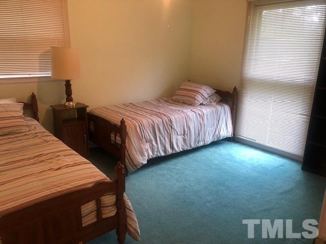 2822 Ellis Road Durham, NC 27703 - Photo 14 of 37 a bedroom with a bed and a window