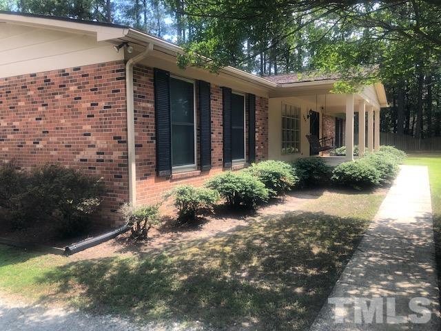 2822 Ellis Road Durham, NC 27703 - Photo 2 of 37 a front view of a house with garden