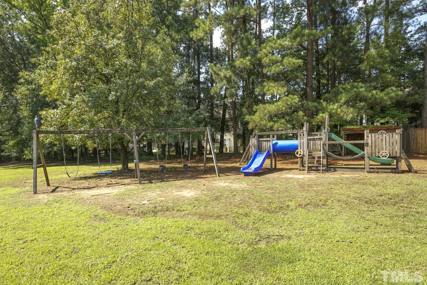 2822 Ellis Road Durham, NC 27703 - Photo 32 of 37 a view of a park with swings and slides