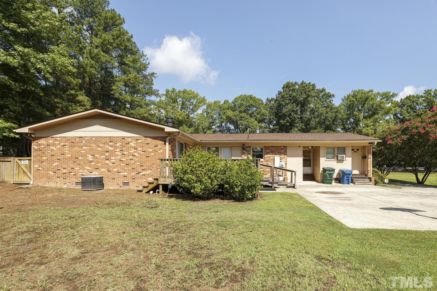 2822 Ellis Road Durham, NC 27703 - Photo 33 of 37 a front view of a house with a yard