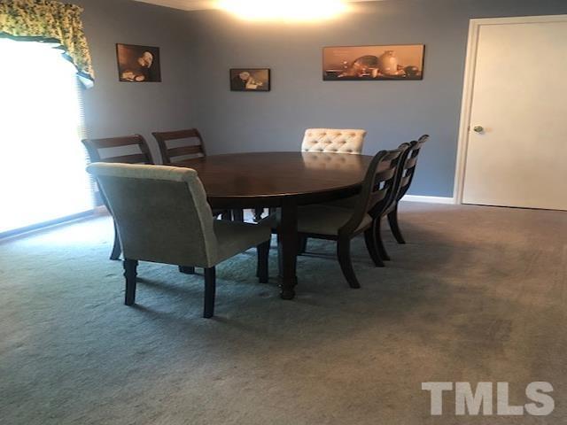2822 Ellis Road Durham, NC 27703 - Photo 6 of 37 a view of a dining room with furniture and window