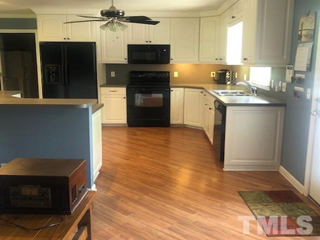 2822 Ellis Road Durham, NC 27703 - Photo 8 of 37 a kitchen with stainless steel appliances granite countertop a refrigerator and a stove top oven