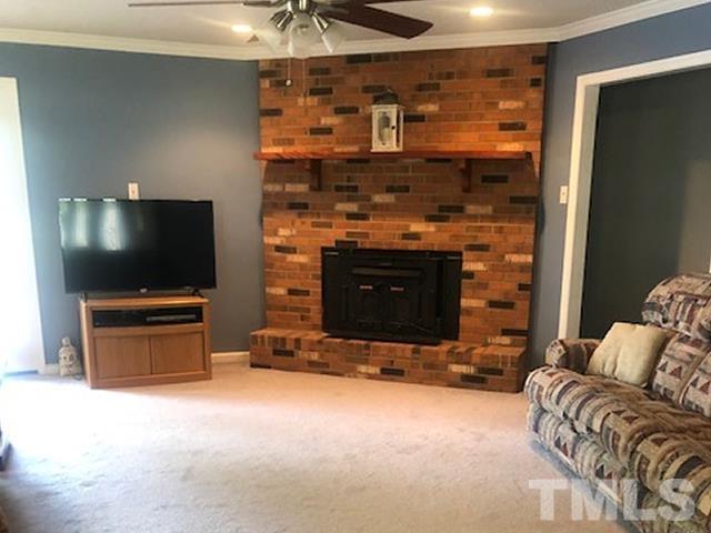 2822 Ellis Road Durham, NC 27703 - Photo 9 of 37 a living room with furniture and a flat screen tv