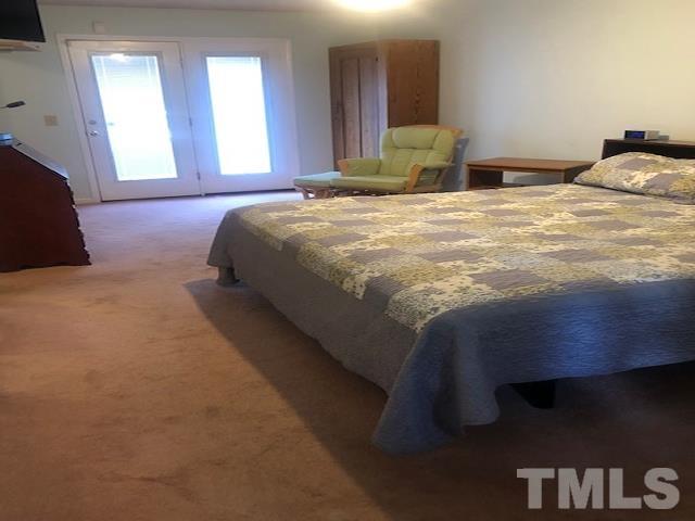 2822 Ellis Road Durham, NC 27703 - Photo 10 of 37 a bedroom with a bed and window