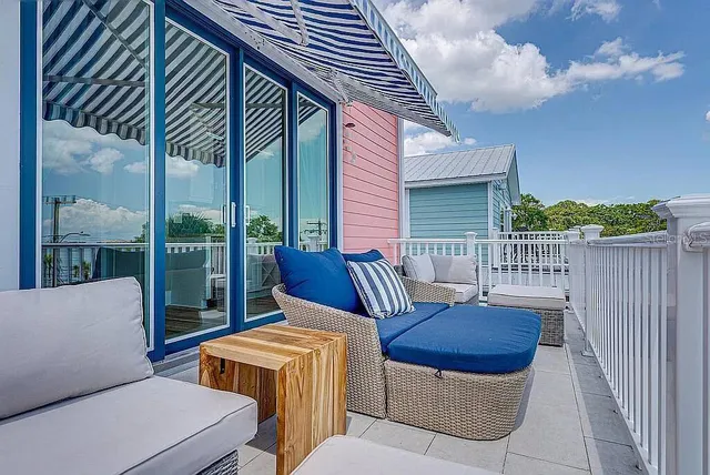 a view of a balcony with furniture