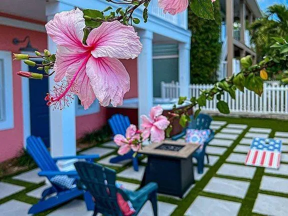 an aerial view of house with yard and ocean view