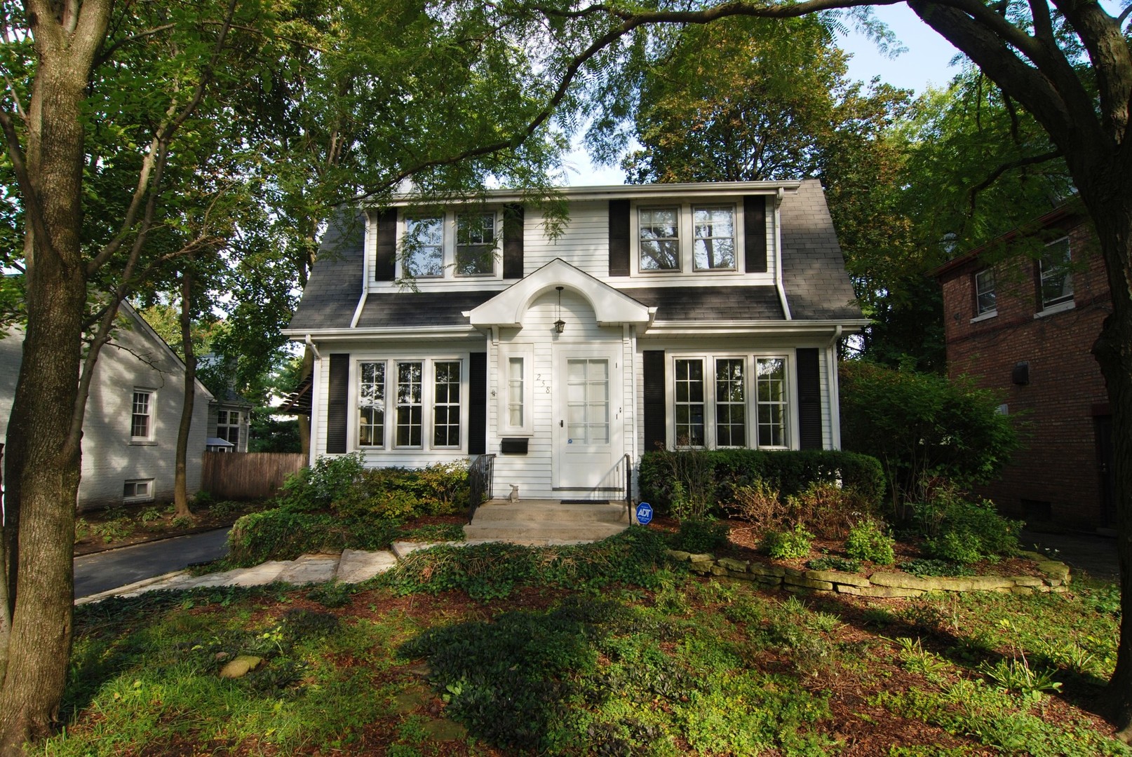 258 Lionel Road Riverside, IL 60546 - Photo 2 of 20 a front view of a house with a yard