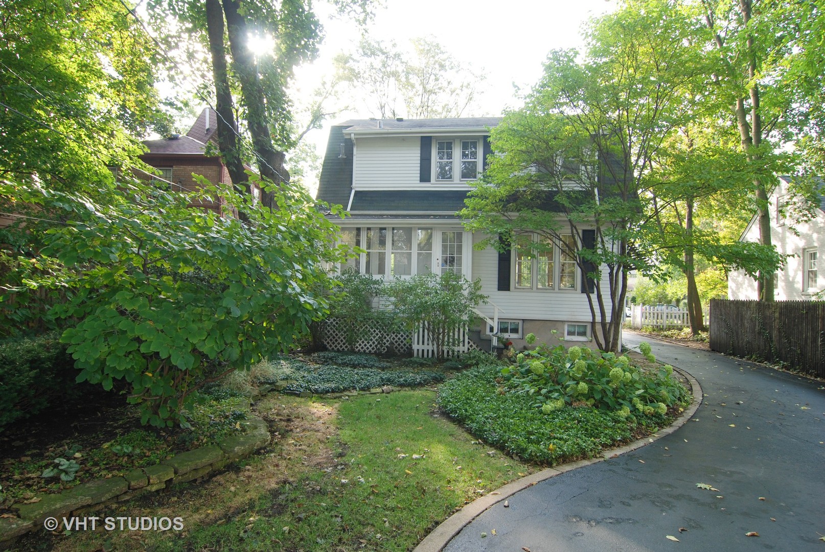 258 Lionel Road Riverside, IL 60546 - Photo 15 of 20 front view of a house with a garden