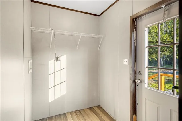 a view of an empty room with a window