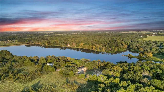 a view of a garden with lawn chairs