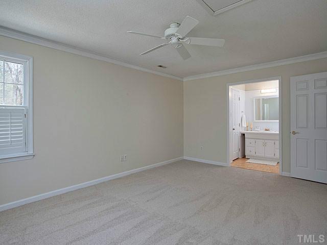 3933 Swarthmore Road Durham, NC 27707 - Photo 15 of 24 Master bedroom (new carpet, new paint, ceiling fan) with view of master bathroom.
