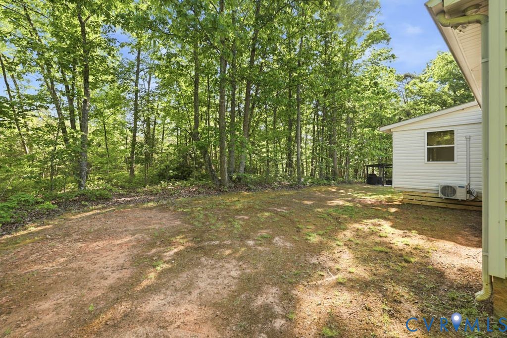 5307 St Pauls Church Road Goochland, VA 23063 - Photo 42 of 44 a view of a house with backyard and trees