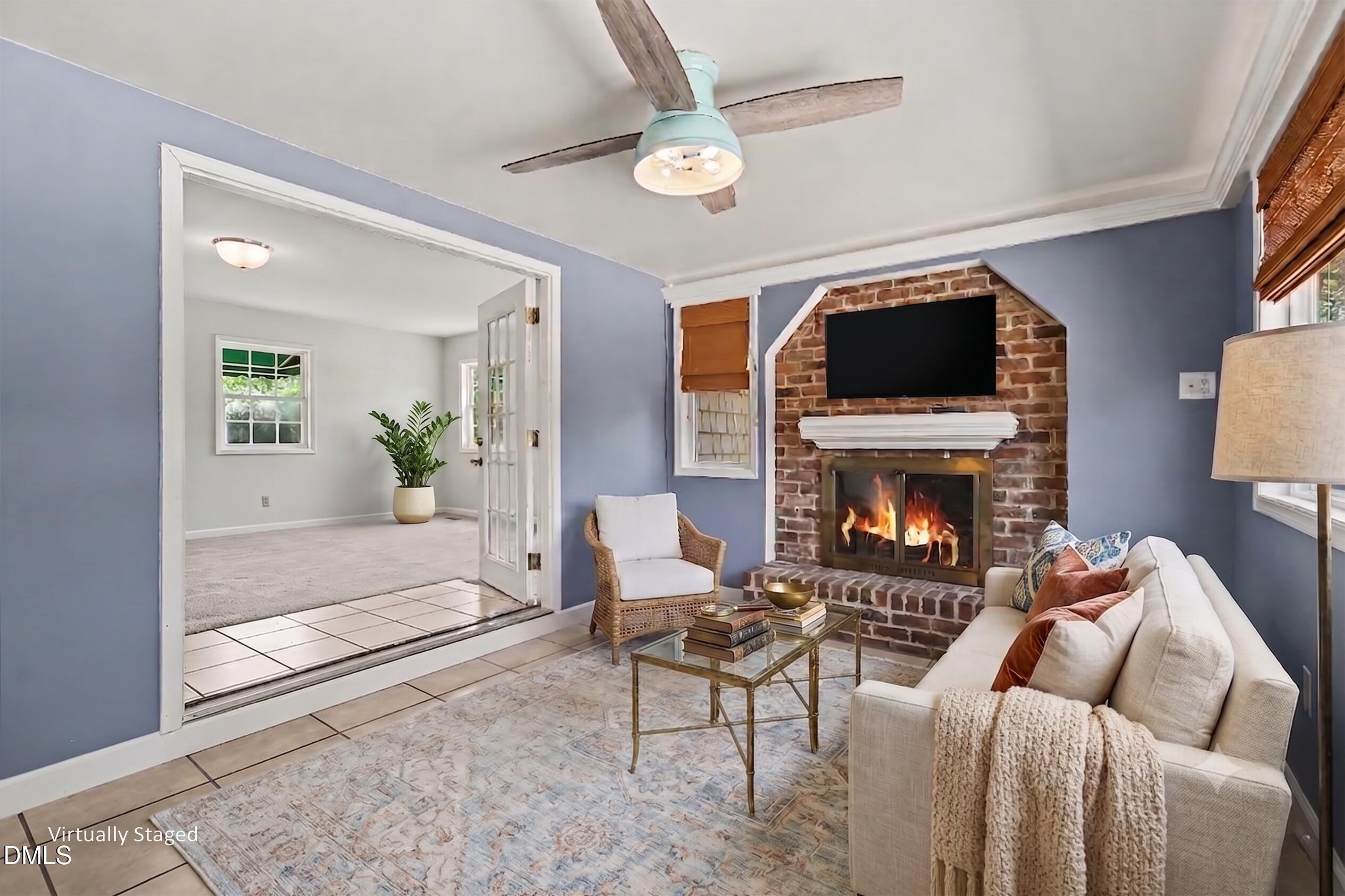 1782 Chicora Road Dunn, NC 28334 - Photo 33 of 72 a living room with furniture a flat screen tv and a fireplace