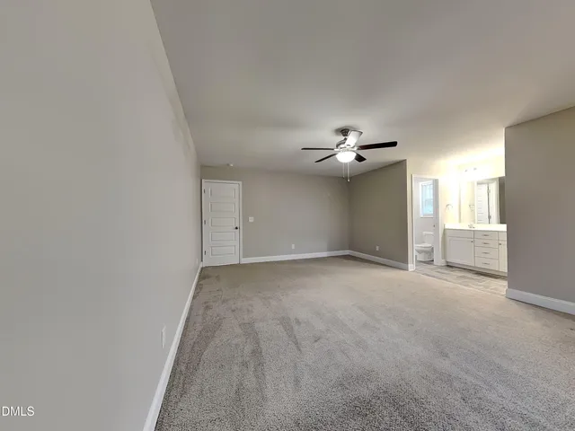 a view of a livingroom with a chandelier fan