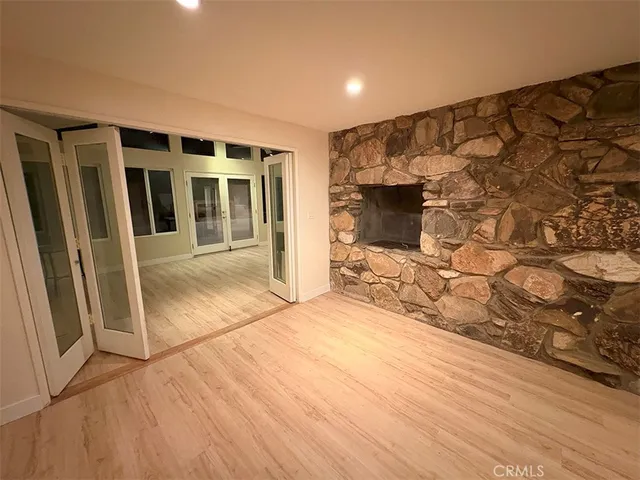 a kitchen with stainless steel appliances a refrigerator sink and microwave