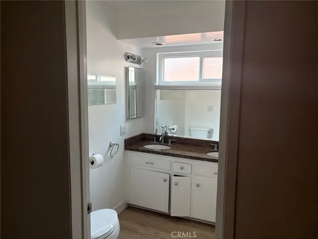 a view of an entryway and wooden floor