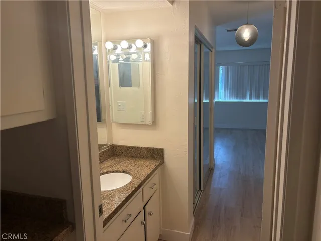 a view of an empty room and a window