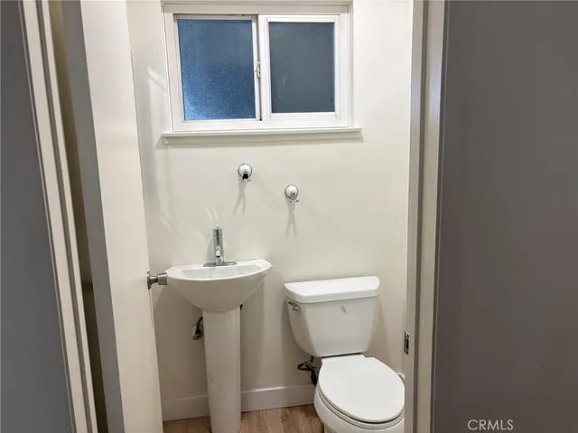 a view of front door with wooden floor