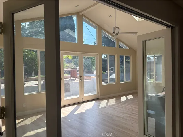 a view of an entryway with wooden floor