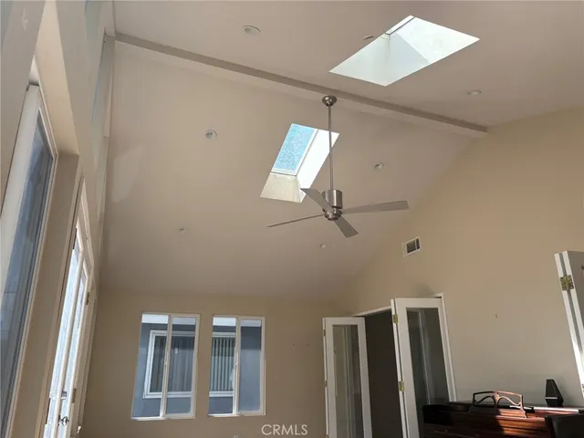 a view of room with stairs and wooden floor