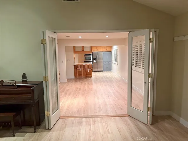 a view of a hardwood floor and workspace