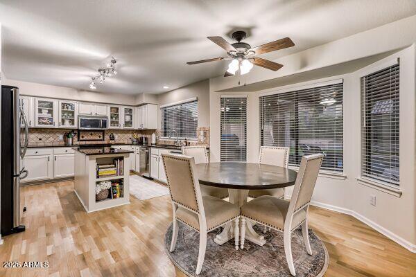 1609 East Mohawk Lane Phoenix, AZ 85024 - Photo 12 of 31 a kitchen with kitchen island a large counter top space and stainless steel appliances