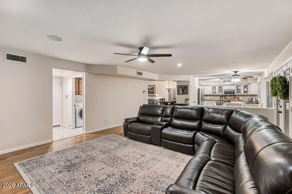 a bathroom with a tub a double vanity sink and a mirror