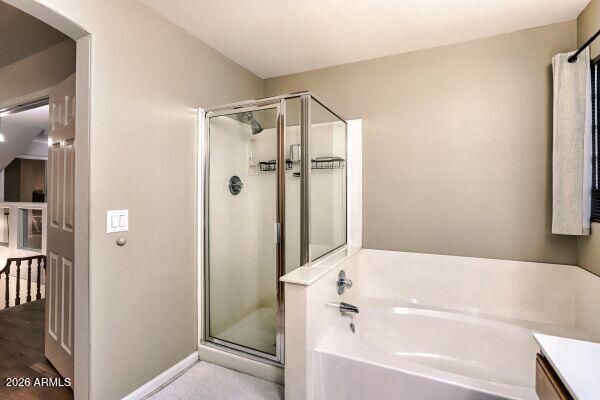 1609 East Mohawk Lane Phoenix, AZ 85024 - Photo 21 of 31 a bathroom with a bathtub and a shower