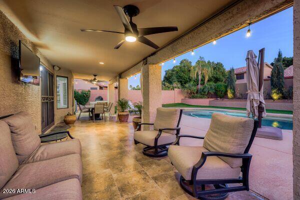 1609 East Mohawk Lane Phoenix, AZ 85024 - Photo 26 of 31 a living room with patio furniture and a flat screen tv