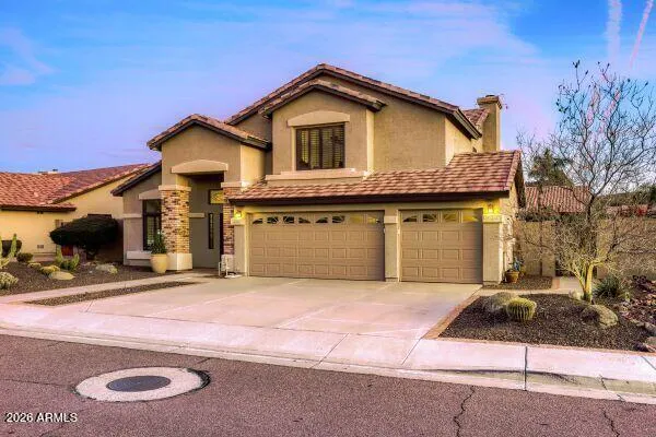 a kitchen with stainless steel appliances granite countertop a refrigerator a stove top oven a sink dishwasher and white cabinets