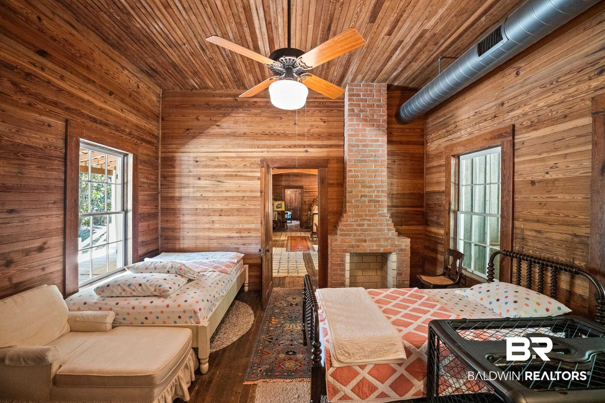 30671 Magnolia Street Elberta, AL 36530 - Photo 31 of 68 Bedroom with wooden ceiling, wood finished floors, and wooden walls