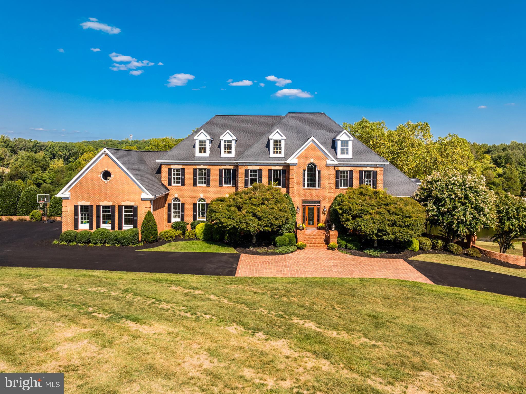 22609 Hillside Circle Leesburg, VA 20175 - Photo 1 of 110 a front view of a house with yard and green space