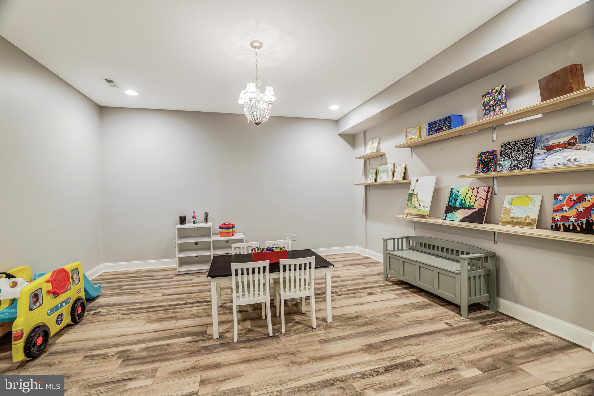 22609 Hillside Circle Leesburg, VA 20175 - Photo 105 of 110 a view of a play room with furniture and wooden floor