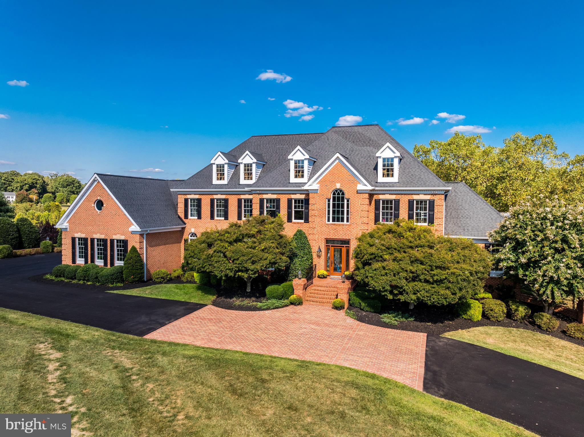 22609 Hillside Circle Leesburg, VA 20175 - Photo 3 of 110 a front view of a house with yard and green space