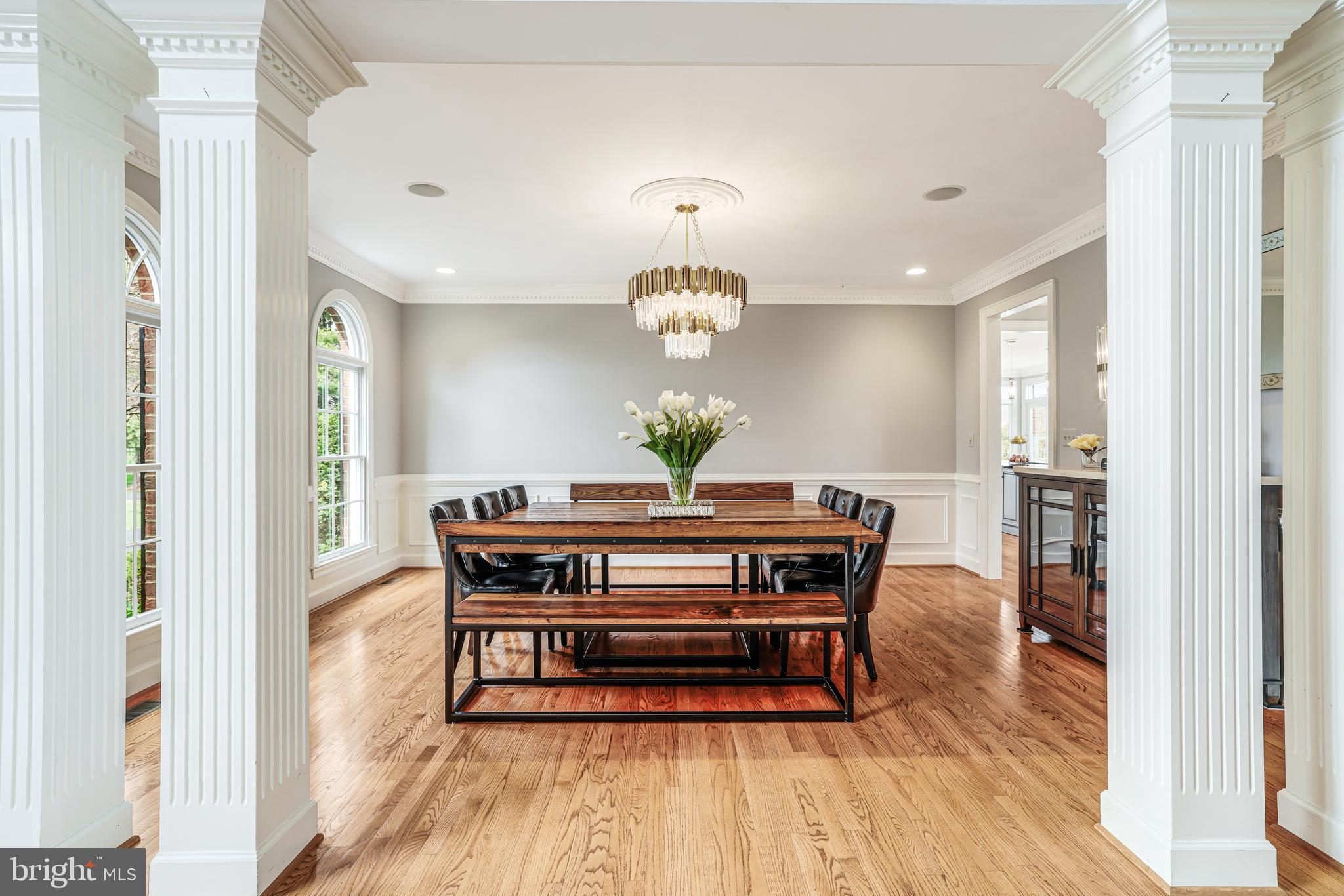 22609 Hillside Circle Leesburg, VA 20175 - Photo 33 of 110 a view of a dining room with furniture wooden floor and chandelier